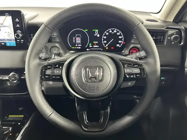 ホンダ ヴェゼル ハイブリッド e:HEV Z 佐賀県 2025(令7)年 0.1千km プラチナホワイトパール 純正ナビ　/フルセグテレビ/アップルカープレイ・アンドロイドオート/衝突被害軽減装置　/追従型クルーズコントロール　/ブラインドスポットモニター　/置くだけ充電　/シートヒーター　/ハンドルヒーター　/バックカメラ　/レーンキープアシスト　/スペアキー　/ＥＴＣ２．０/コーナーセンサー/パドルシフト/純正アルミホイール/ダウンヒルアシストコントロール/チップアップシート