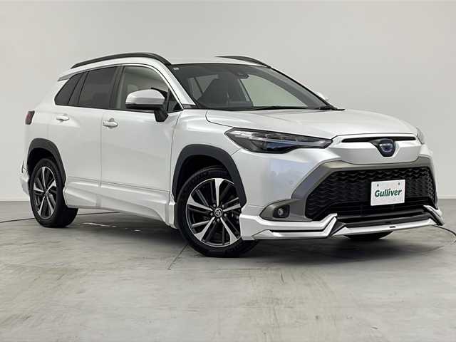 トヨタ カローラ クロス ハイブリッド Z 愛知県 2022(令4)年 6万km プラチナホワイトパールマイカ 純正9型ディスプレイオーディオ/AM/FM/CD/DVD/USB/BT/Miracast/フルセグ/Apple Car Play/Android Auto/スマートキー＆プッシュスタート/バックカメラ/モデリスタエアロ（フロント、リヤ、サイド）/ＤＶＤデッキ/ビルトインＥＴＣ2.0/パワーシート/電動格納ウィンカーミラー/ハーフレザーシート/シートヒーター(D/N席)/革巻きステアリング/ドライブレコーダー/Toyota Safety Sense/LTA/PCS/PKSB/RSA/LEDオートヘッドライト/LEDフォグライト/18インチ純正アルミホイール