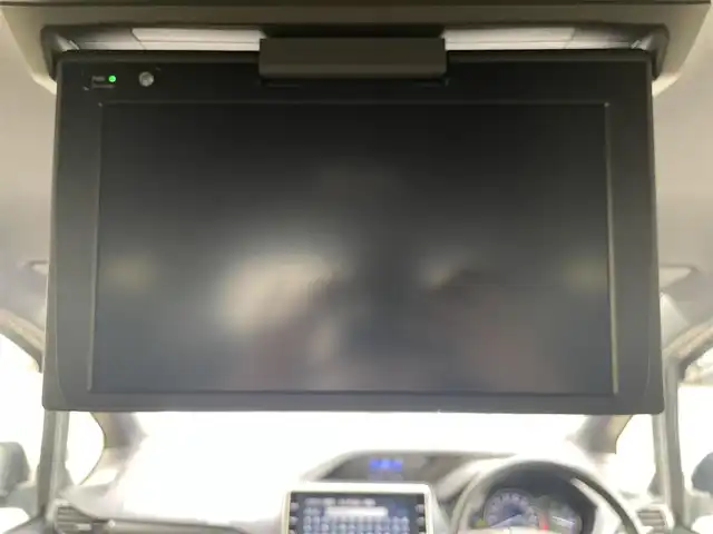 トヨタ ヴォクシー ハイブリッド ZS 煌Ⅱ 大阪府 2019(令1)年 4.5万km ブラッキッシュアゲハガラスフレーク T-Connect１０インチナビ（NSZN-Z68T）/純正12.1インチフリップダウンモニター（V12T-R68C)/クルーズコントロール/バックモニター/両側パワースライドドア/前後コーナーセンサー/衝突軽減システム/レーンキープアシスト/前席シートヒーター/後席サンシェード/純正ドライブレコーダー/純正ＥＴＣ/純正16インチAW/保証書/取り扱い説明書/スペアキーX1
