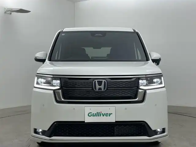 ホンダ ステップワゴン スパーダ eHEV 岡山県 2025(令7)年 0.1万km未満 プラチナホワイトパール 登録済未使用車	/純正11.4インチメモリナビゲーション		/【フルセグ/Bluetooth/DVD/MSV/MSP】		/バックカメラ/純正16inアルミホイール+サマータイヤ：装着			/フロント・サイド・リアエアロパーツ		/レーダークルーズコントロール			/LEDヘッドライト（AUTO機能付き）		/シートヒーター		/横滑り防止機能		/衝突軽減システム		/車線逸脱防止システム				/スマートキー		/ステアリングスイッチ		/プッシュスタート		/コーナーセンサー				/新車保証書		/取扱説明書		/スペアキー×１