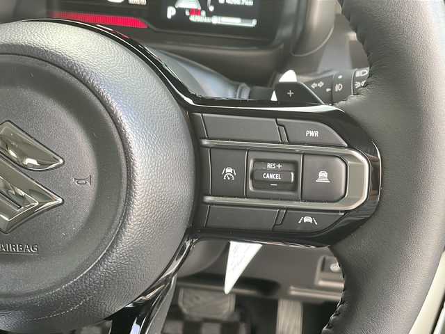 スズキ スペーシア カスタム HYBRID XS ターボ 山口県 2024(令6)年 0.5万km ピュアホワイトP 社外8インチナビ【AVIC-RL99】/・フルセグテレビ/・Bluetooth/・CD／DVD/両側パワースライドドア/ETC/ワンオーナー/レーダークルーズコントロール/シートヒーター【D＋N席】/USB充電口/タイプC充電口/ステアリングスイッチ/ステアリングホールド/ステアリングヒーター/パドルシフト/フルフラットシート/オットマン/助手席シートアンダーボックス/スズキセーフティサポート/・デュアルセンサーブレーキサポートII/・誤発信抑制機能/・後方誤発信抑制機能/・低速時ブレーキサポート（前進・後退）/・パーキングセンサー（フロント・リア）/・車線逸脱警報機能/・車線逸脱抑制機能/・ふらつき警報機能/・発進お知らせ機能/・標識認識機能/・ヘッドアップディスプレイ/・車線維持支援機能
