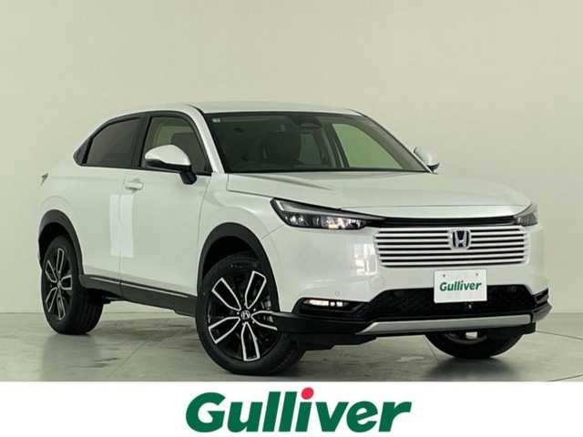 ホンダ ヴェゼル ハイブリッド e:HEV Z 大阪府 2025(令7)年 0.1千km プラチナホワイトパール ホンダセンシング/　・衝突軽減ブレーキ　CMBS/　・先行車発進お知らせ機能/　・アダプティブクルーズコントロール　ACC/　・車線維持支援システム　LKAS/　・トラフィックジャムアシスト/　・ブラインドスポットフォーメーション/　・誤発進抑制機能/　・後方お発進抑制機能/　・パーキングセンサーシステム/　・オートハイビーム/純正ディーラーOPナビ/　Bluetooth/フルセグ/FM/バックカメラ/パワーバックドア/LEDオートライト/フォグランプ/ハーフレザーシート/シートヒーター/ワイヤレス充電器/スマートキー/ビルトインETC/ステアリングスイッチ