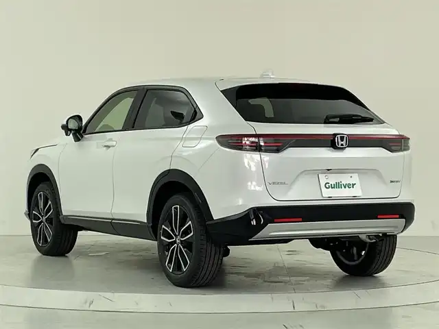 ホンダ ヴェゼル ハイブリッド e:HEV Z 大阪府 2025(令7)年 0.1千km プラチナホワイトパール ホンダセンシング/　・衝突軽減ブレーキ　CMBS/　・先行車発進お知らせ機能/　・アダプティブクルーズコントロール　ACC/　・車線維持支援システム　LKAS/　・トラフィックジャムアシスト/　・ブラインドスポットフォーメーション/　・誤発進抑制機能/　・後方お発進抑制機能/　・パーキングセンサーシステム/　・オートハイビーム/純正ディーラーOPナビ/　Bluetooth/フルセグ/FM/バックカメラ/パワーバックドア/LEDオートライト/フォグランプ/ハーフレザーシート/シートヒーター/ワイヤレス充電器/スマートキー/ビルトインETC/ステアリングスイッチ