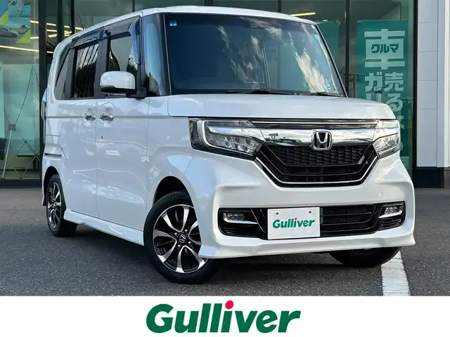 ホンダ Ｎ ＢＯＸ カスタム G L ホンダセンシング 島根県 2019(平31)年 1.9万km プラチナホワイトパール 登録時走行距離18866km/ワンオーナー/社外ナビ/Bluetooth・AM・FM・CD・DVD/フルセグTV/片側パワースライドドア/ホンダセンシング/レーダークルーズコントロール/レーンキープアシスト/横滑り防止装置/衝突被害軽減ブレーキ/コーナーセンサー/LEDヘッドライト/オートライト/純正AW14インチ/スマートキー/プッシュスタート/ドアバイザー/禁煙車/新品スタッドレスタイヤ有