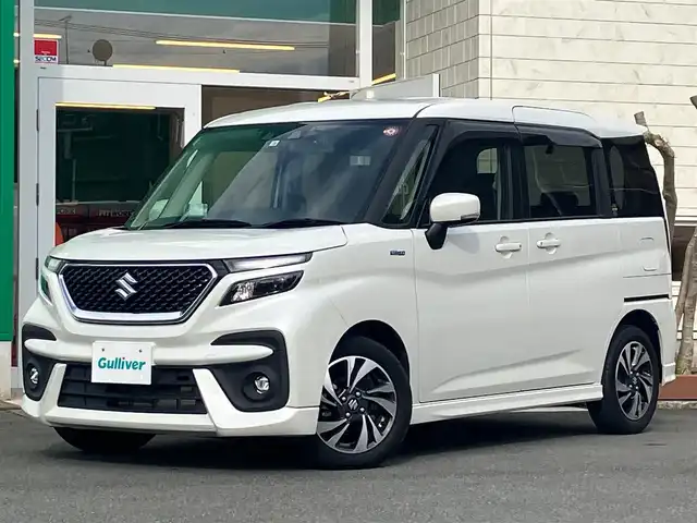 スズキ ソリオ バンディット HV MV 静岡県 2022(令4)年 3.4万km ピュアホワイトP SDナビ(CD/DVD/BT/フルセグ)/バックカメラ/レーダークルーズコントロール/ドライブレコーダー前後/ETC/エンジンスタートボタン/パワーウィンドウ/パワーステアリング/アイドリングストップ/スマートキー/オートエアコン/USB入力端子/ウォークスルー/純正フロアマット/布シート/D席N席シートヒーター/左側パワースライドドア/右側スライドドア/純正アルミホイール/ABS/横滑り防止装置/コーナーセンサー/レーンキープアシスト/盗難防止装置/オートライト/オートマチックハイビーム/LEDヘッドライト/W+サイドエアバック/衝突軽減システム/ヘッドアップディスプレイ