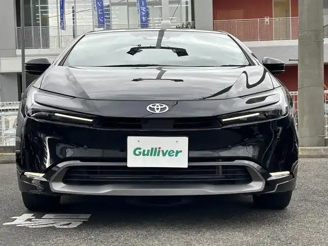 トヨタ プリウス Z 長崎県 2024(令6)年 7万km アティチュードブラックマイカ プッシュスタート/純正ナビ付ディスプレイオーディオ（AM/FM/BT/TV)/クルーズコントロール/オートライト/オートハイビーム/ハンドルヒーター/シートヒーター（D/N)/エアシート（D/N)/パワーバックドア/ETC2.0/電子サイドブレーキ/ブレーキホールド/バックカメラ/全方位カメラ/トヨタセーフティセンス/横滑り防止装置/レーンキープアシスト/充電Cタイプ/AC100V/デジタルインナーミラー