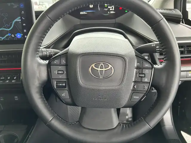 トヨタ プリウス Z 長崎県 2024(令6)年 7万km アティチュードブラックマイカ プッシュスタート/純正ナビ付ディスプレイオーディオ（AM/FM/BT/TV)/クルーズコントロール/オートライト/オートハイビーム/ハンドルヒーター/シートヒーター（D/N)/エアシート（D/N)/パワーバックドア/ETC2.0/電子サイドブレーキ/ブレーキホールド/バックカメラ/全方位カメラ/トヨタセーフティセンス/横滑り防止装置/レーンキープアシスト/充電Cタイプ/AC100V/デジタルインナーミラー