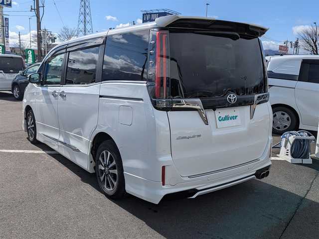 トヨタ エスクァイア Gi プレミアムパッケージ ブラックテーラード 福井県 2021(令3)年 3.3万km ホワイトパールクリスタルシャイン モデリスタエアロ/後席フリップダウンモニター/純正15インチAW/両側パワースライドドア/リアルーフスポイラー/クルーズコントロール/前後ドライブレコーダー/前後コーナーセンサー/ステアリングヒーター/LEDヘッドライト/Fフォグ/シートヒーター/バックカメラ/純正10インチナビ/フルセグテレビ/ビルトインETC/衝突被害軽減システム/レーンキープアシスト/横滑り防止装置/盗難防止装置