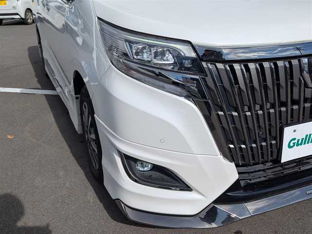 トヨタ エスクァイア Gi プレミアムパッケージ ブラックテーラード 福井県 2021(令3)年 3.3万km ホワイトパールクリスタルシャイン モデリスタエアロ/後席フリップダウンモニター/純正15インチAW/両側パワースライドドア/リアルーフスポイラー/クルーズコントロール/前後ドライブレコーダー/前後コーナーセンサー/ステアリングヒーター/LEDヘッドライト/Fフォグ/シートヒーター/バックカメラ/純正10インチナビ/フルセグテレビ/ビルトインETC/衝突被害軽減システム/レーンキープアシスト/横滑り防止装置/盗難防止装置