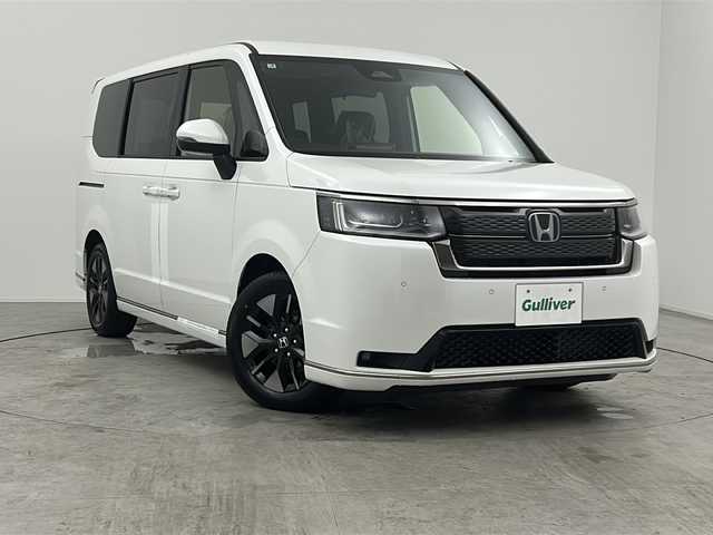 ホンダ ステップワゴン スパーダ eHEV 三重県 2025(令7)年 0.1万km未満 プラチナホワイトパール 登録済未使用車/純正11.4インチナビ/フルセグTV/CD/DVD/Bluetooth/両側パワースライドドア/前席シートヒーター/純正アルミホイール/ホンダセンシング/衝突軽減ブレーキシステム/レーダークルーズコントロール/レーンキープアシストシステム/BSM/オートハイビーム/パワーバックドア/2列目オットマン/全列USBチャージャー