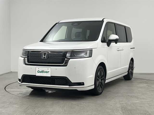 ホンダ ステップワゴン スパーダ eHEV 三重県 2025(令7)年 0.1万km未満 プラチナホワイトパール 登録済未使用車/純正11.4インチナビ/フルセグTV/CD/DVD/Bluetooth/両側パワースライドドア/前席シートヒーター/純正アルミホイール/ホンダセンシング/衝突軽減ブレーキシステム/レーダークルーズコントロール/レーンキープアシストシステム/BSM/オートハイビーム/パワーバックドア/2列目オットマン/全列USBチャージャー