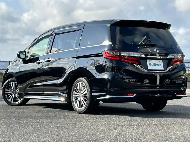 ホンダ オデッセイ ハイブリッド アブソルート・EXホンダセンジング 島根県 2019(令1)年 3.6万km クリスタルブラックパール 純正9インチナビ/CD/DVD/DTV/Bluetooth/HDMI/USB/マルチビューカメラ/スマートパーキングアシスト/コーナーセンサー /BSM/ウェルカムライト付両側パワースライドドア/ホンダセンシング/・衝突軽減ブレーキ/・歩行者事故低減ステアリング/・アダプティブクルーズコントロール/・車線維持支援システム（LKAS）/・路外逸脱抑制機能/・誤発進抑制機能/・先行車発進お知らせ機能/・標識認識機能/ビルトインETC2.0/大型アームレスト/前席パワーシート/シートヒーター/ミラーヒーター/革巻きステアリングホイール/ステアリングスイッチ/LEDオートライト/LEDフォグランプ/前後ドライブレコーダー/プラズマクラスター付左右独立オートエアコン/リアオートエアコン/取扱説明車/新車時保証書