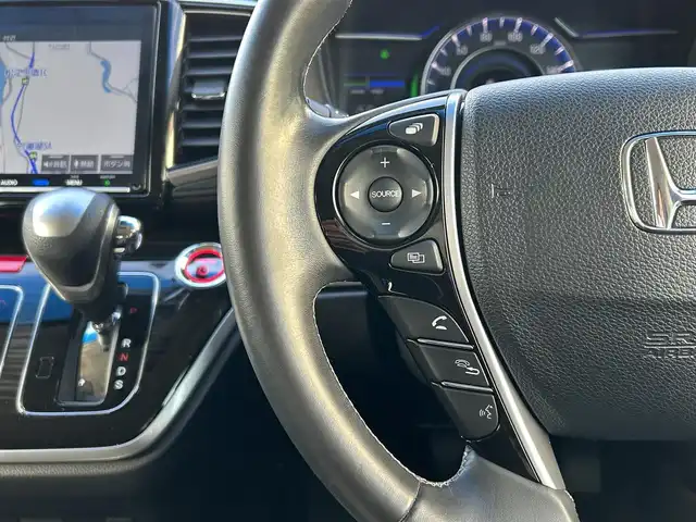 ホンダ オデッセイ ハイブリッド アブソルート・EXホンダセンジング 島根県 2019(令1)年 3.6万km クリスタルブラックパール 純正9インチナビ/CD/DVD/DTV/Bluetooth/HDMI/USB/マルチビューカメラ/スマートパーキングアシスト/コーナーセンサー /BSM/ウェルカムライト付両側パワースライドドア/ホンダセンシング/・衝突軽減ブレーキ/・歩行者事故低減ステアリング/・アダプティブクルーズコントロール/・車線維持支援システム（LKAS）/・路外逸脱抑制機能/・誤発進抑制機能/・先行車発進お知らせ機能/・標識認識機能/ビルトインETC2.0/大型アームレスト/前席パワーシート/シートヒーター/ミラーヒーター/革巻きステアリングホイール/ステアリングスイッチ/LEDオートライト/LEDフォグランプ/前後ドライブレコーダー/プラズマクラスター付左右独立オートエアコン/リアオートエアコン/取扱説明車/新車時保証書