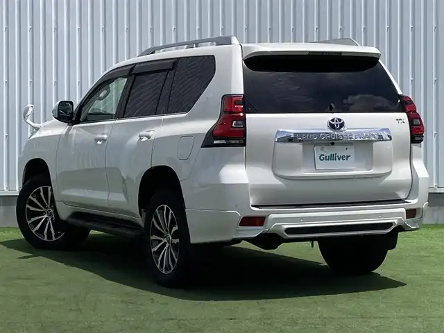 トヨタ ランドクルーザー プラド TX Lパッケージ 香川県 2019(令1)年 8万km ホワイトパールクリスタルシャイン 登録時走行距離：79972km/ディーラー純正9型ナビ/　CD DVD BT フルセグTV/バックカメラ/サンルーフ/TRDエアロ（フロント・リアアンダー）/オプション19インチアルミ/ブラックレザーシート/シートヒーター/エアシート/パワーシート/プリクラッシュセーフティシステム/レーンキープアシスト/レーダークルーズコントロール/ダウンヒルアシストコントロール/クリアランスソナー/ビルトインETC/ドライブレコーダー/MTモード付AT/横滑り防止装置/4WD/ディーゼルターボ/LEDヘッドライト/オートライト/フォグランプ/木目革巻きコンビステアリング/ステアリングスイッチ/プッシュスタート/スマートキー/スペアキー