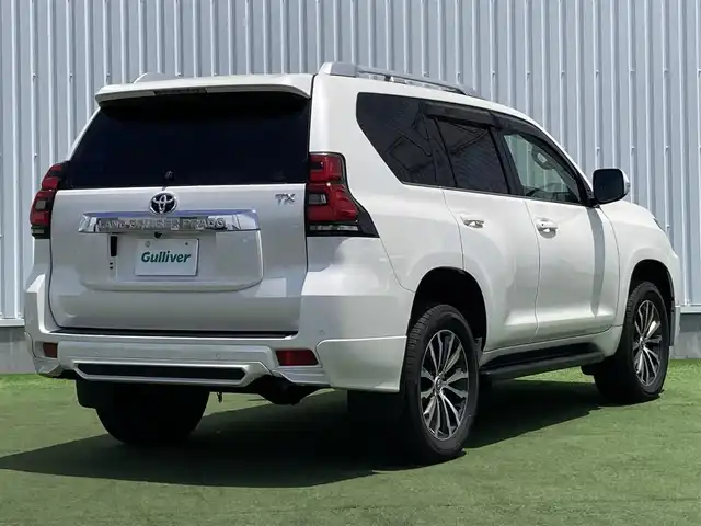 トヨタ ランドクルーザー プラド TX Lパッケージ 香川県 2019(令1)年 8万km ホワイトパールクリスタルシャイン 登録時走行距離：79972km/ディーラー純正9型ナビ/　CD DVD BT フルセグTV/バックカメラ/サンルーフ/TRDエアロ（フロント・リアアンダー）/オプション19インチアルミ/ブラックレザーシート/シートヒーター/エアシート/パワーシート/プリクラッシュセーフティシステム/レーンキープアシスト/レーダークルーズコントロール/ダウンヒルアシストコントロール/クリアランスソナー/ビルトインETC/ドライブレコーダー/MTモード付AT/横滑り防止装置/4WD/ディーゼルターボ/LEDヘッドライト/オートライト/フォグランプ/木目革巻きコンビステアリング/ステアリングスイッチ/プッシュスタート/スマートキー/スペアキー