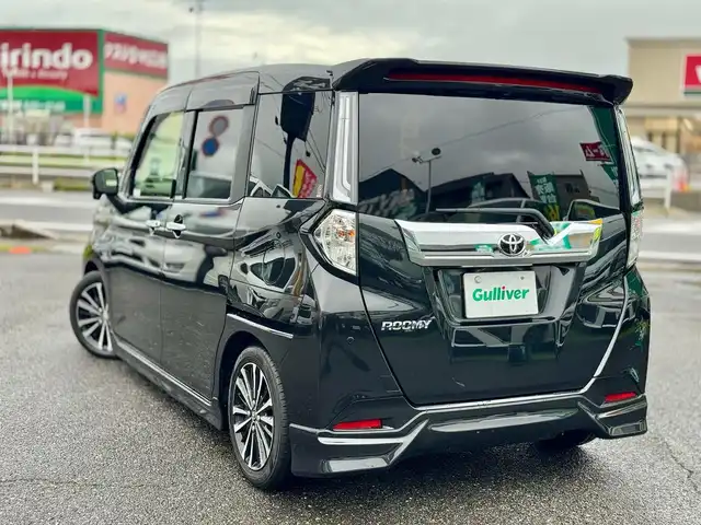 トヨタ ルーミー カスタムG－T 滋賀県 2022(令4)年 2.4万km ブラックマイカメタリック ワンオーナー/純正9インチフルセグナビ/　フルセグ Bluetooth CD DVD SD AM FM/パノラミックビューモニター/モデリスタエアロ /スマートアシスト/衝突回避支援ブレーキ/衝突警報機能/車線逸脱警報機能/路側逸脱警報/ふらつき警報/ブレーキ制御付誤発進抑制機能/先行車発進お知らせ機能/アダプティブドライビングビーム/サイドビューランプ/コーナーセンサー/標識認識機能/アダプティブクルーズコントロール/両側パワースライドドア/ビルトインETC/ローダウン（RSRダウンサス）純正サス積み込み/シートヒーター/純正15インチアルミ/純正ドアバイザー/純正フロアマット/スマートキー×2/