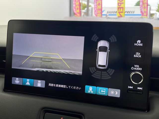 ホンダ ヴェゼル ハイブリッド e:HEV Z 大阪府 2025(令7)年 0.1千km プラチナホワイトパール 純正9インチディスプレイオーディオ/【ナビ有/AM/FM/Bluetooth/フルセグTV】/バックカメラ/ビルトインETC2.0/置くだけ充電/電動パーキングブレーキ/ホンダセンシング/・衝突軽減ブレーキ(CMBS)/・路外逸脱抑制機能/・アダプティブ・クルーズ・コントロール/・車線維持支援システム/・トラフィックジャムアシスト/・急アクセル抑制機能/・標識認識機能/・ブラインドスポットモニター/純正18インチAW/スペアキー×1