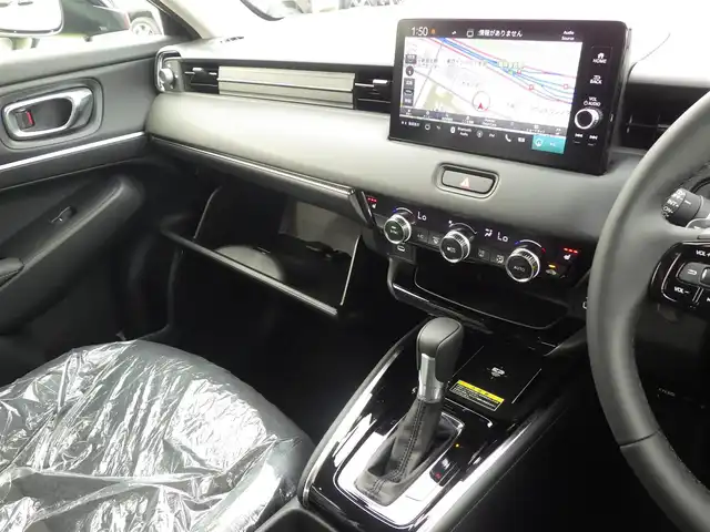 ホンダ ヴェゼル ハイブリッド e:HEV Z 千葉県 2025(令7)年 0.1千km クリスタルブラックパール e:HEV Z　4VC4AZ　Honda CONNECTディスプレー+ETC2.0車載器+ワイヤレス充電器(231000)/ホンダセンシング/・衝突軽減ブレーキ（CMBS）/・車線維持支援システム（LKAS）/・アダプティブクルーズコントロール（ACC）/・ブラインドスポットインフォメーション/・後方誤発進抑制機能/・誤発進抑制機能/パワーバックドア/ハーフレザーシート/前席シートヒーター/純正コネクトナビ/地デジTV/【Bluetooth接続】/【Apple CarPlay　Android Auto対応】/バックカメラ/ワイヤレス充電/革巻きステアリング/ステアリングスイッチ/パドルシフト/ETC（2.0）/LEDヘッドライト/フォグライト/ウインカーミラー/コーナーセンサー/純正18インチアルミホイル/サイド/カーテンエアバッグ/Honda スマートキー