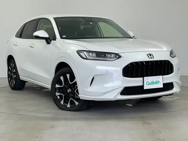 ホンダ ＺＲ－Ｖ ハイブリッド e:HEV Z 新潟県 2023(令5)年 1.9万km プラチナホワイトパール 純正ホンダコネクトディスプレイナビ/（BT/FM/AM/フルセグTV)/全周囲カメラ/ステアリングスイッチ/ステアリングヒーター/パドルシフト/置くだけ充電/D/Nパワーシート/レザーシート/シートヒーター/シートメモリー/ブラインドスポットモニター/ETC/取扱説明書/保証書/整備記録簿