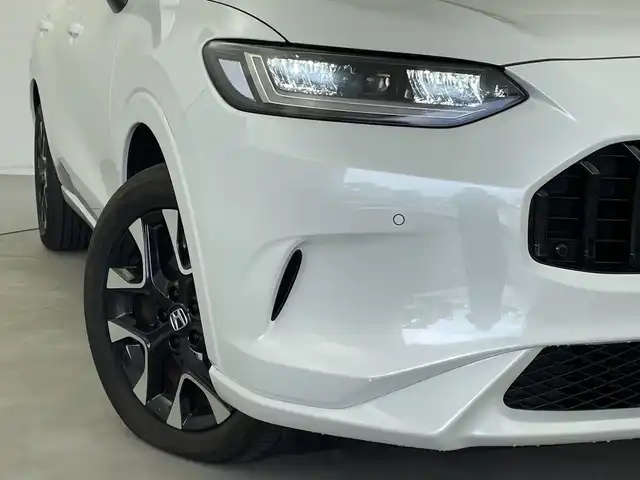 ホンダ ＺＲ－Ｖ ハイブリッド e:HEV Z 新潟県 2023(令5)年 1.9万km プラチナホワイトパール 純正ホンダコネクトディスプレイナビ/（BT/FM/AM/フルセグTV)/全周囲カメラ/ステアリングスイッチ/ステアリングヒーター/パドルシフト/置くだけ充電/D/Nパワーシート/レザーシート/シートヒーター/シートメモリー/ブラインドスポットモニター/ETC/取扱説明書/保証書/整備記録簿