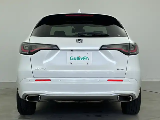 ホンダ ＺＲ－Ｖ ハイブリッド e:HEV Z 新潟県 2023(令5)年 1.9万km プラチナホワイトパール 純正ホンダコネクトディスプレイナビ/（BT/FM/AM/フルセグTV)/全周囲カメラ/ステアリングスイッチ/ステアリングヒーター/パドルシフト/置くだけ充電/D/Nパワーシート/レザーシート/シートヒーター/シートメモリー/ブラインドスポットモニター/ETC/取扱説明書/保証書/整備記録簿