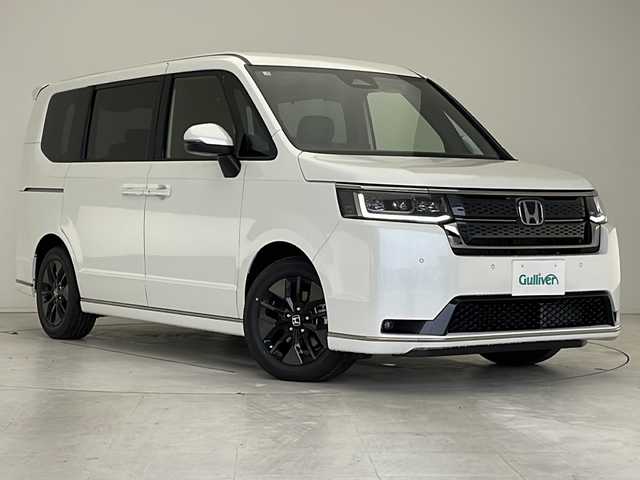 ホンダ ステップワゴン スパーダ eHEV 愛知県 2025(令7)年 0.1万km未満 プラチナホワイトパール 登録済未使用車/衝突軽減システム/純正ナビ/両側パワースライドドア/レーダークルーズコントロール/シートヒーター/電動リアゲート/バックカメラ/フルセグ/CD DVD/Bluetooth/コーナーセンサー/純正アルミホイール/ブラインドスポットモニター/LEDヘッドライト/パドルシフト/電動リアゲート/ステアリングスイッチ/スマートキー/プッシュスタート