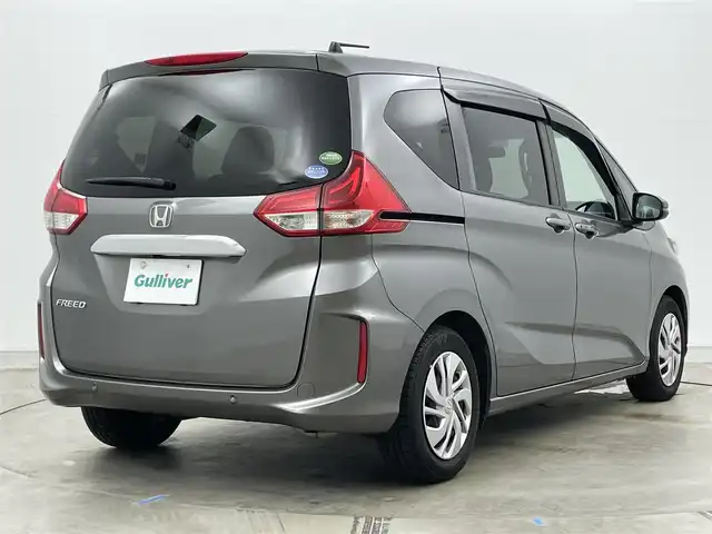 ホンダ フリード G ホンダセンシング 岡山県 2020(令2)年 5.6万km スーパープラチナグレーメタリック 純正9インチメモリナビ/　「フルセグ/BT/CD/DVD/USB」/フリップダウンモニター（HDMI接続有り）/ワイパーデアイサー/バックカメラ/追従型クルーズコントロール/ビルトインETC/前席シートヒーター/衝突軽減ブレーキシステム/車線逸脱防止システム/横滑り防止装置/純正１５インチアルミ/純正フロアマット/ヘッドライトレベライザー/ハロゲンヘッドライト（AUTO機能付き）/ステアリングスイッチ/プッシュスタート/スマートキー×1