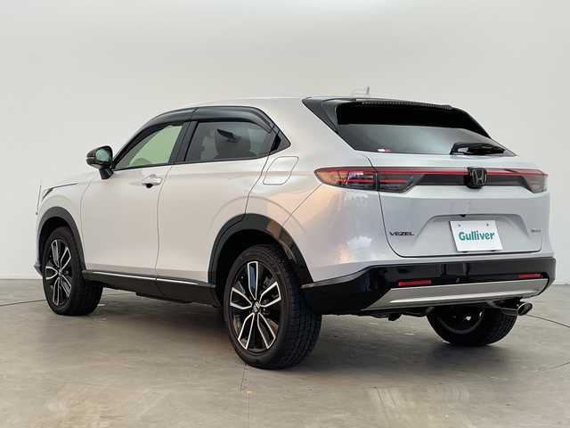ホンダ ヴェゼル ハイブリッド e:HEV Z 富山県 2024(令6)年 1.7万km プレミアムサンライトホワイトパール ４WD/純正ナビ9インチ/（BT/CD/DVD/FM/AM/USB/Apple Car Play/Android Auto)/フルセグTV/プレミアムサウンド/全方位カメラ/バックカメラ/衝突被害軽減ブレーキ/横滑り防止装置/盗難防止装置/アダプティブクルーズコントロール/レーンキープアシスト/ブラインドスポットモニター/オートマチッックハイビーム/ダウンヒルアシストコントロール/電動リアゲート/置くだけ充電（ワイヤレス充電）/シートヒーター/ETC/ドライブレコーダー前後/スマートキー/プッシュスタート/ドアバイザー