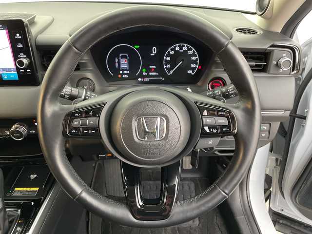 ホンダ ヴェゼル ハイブリッド e:HEV Z 富山県 2024(令6)年 1.7万km プレミアムサンライトホワイトパール ４WD/純正ナビ9インチ/（BT/CD/DVD/FM/AM/USB/Apple Car Play/Android Auto)/フルセグTV/プレミアムサウンド/全方位カメラ/バックカメラ/衝突被害軽減ブレーキ/横滑り防止装置/盗難防止装置/アダプティブクルーズコントロール/レーンキープアシスト/ブラインドスポットモニター/オートマチッックハイビーム/ダウンヒルアシストコントロール/電動リアゲート/置くだけ充電（ワイヤレス充電）/シートヒーター/ETC/ドライブレコーダー前後/スマートキー/プッシュスタート/ドアバイザー