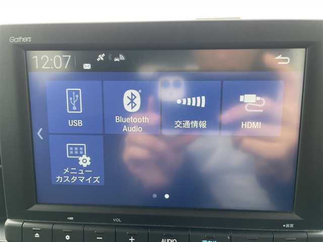 ホンダ ステップワゴン スパーダ 熊本県 2023(令5)年 0.7万km プラチナホワイトパール 純正ナビ/・AM/FM/CD/DVD/BT/SD/・バックカメラ/・TV走行中視聴可能/Honda SENSING/・衝突軽減ブレーキ/・歩行者事故低減ステアリング/・路外逸脱制御機能/・アダプティブクルーズコントロール/・車線維持支援機能/電動格納ミラー/・ブラインドスポットモニター/電動パーキングブレーキ/・ブレーキホールド/ハーフレザーシート/・オットマン（2列目）/・前席シートヒーター/ETC/後席充電ポート（2列目・3列目共に）/後席サンシェード/クリアランスソナー/パドルシフト/シーケンシャルウィンカー/格納シート（3列目）/前後ドライブレコーダー/プッシュスタート/スマートキー