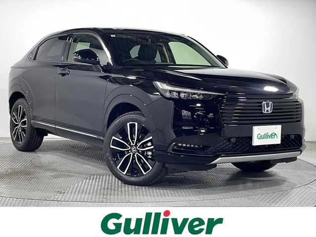 ホンダ ヴェゼル ハイブリッド e:HEV Z 広島県 2025(令7)年 0.1千km クリスタルブラックパール 登録済未使用車（5km）/9型Honda CONNECTディスプレイ/パワーテールゲート/ハーフレザーシート/シートヒーター/ステアリングヒーター/ホンダセンシング/・衝突軽減ブレーキ/・誤発進抑制機能/・レーンキープアシスト/・パーキングセンサー/・アダプティブクルーズコントロール/・アダプティブドライビングビーム/・ブラインドスポットインフォメーション/バックカメラ/減速セレクター/ヒルディセントコントロール/電動パーキングブレーキ/オートブレーキホールド/LEDヘッドランプ/オートライト/ETC2.0/ワイヤレス充電/USB入力端子