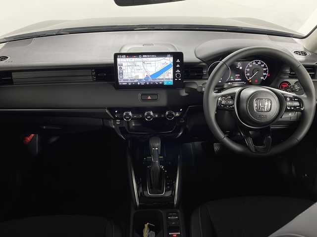 ホンダ ヴェゼル ハイブリッド e:HEV Z 広島県 2025(令7)年 0.1千km クリスタルブラックパール 登録済未使用車（5km）/9型Honda CONNECTディスプレイ/パワーテールゲート/ハーフレザーシート/シートヒーター/ステアリングヒーター/ホンダセンシング/・衝突軽減ブレーキ/・誤発進抑制機能/・レーンキープアシスト/・パーキングセンサー/・アダプティブクルーズコントロール/・アダプティブドライビングビーム/・ブラインドスポットインフォメーション/バックカメラ/減速セレクター/ヒルディセントコントロール/電動パーキングブレーキ/オートブレーキホールド/LEDヘッドランプ/オートライト/ETC2.0/ワイヤレス充電/USB入力端子