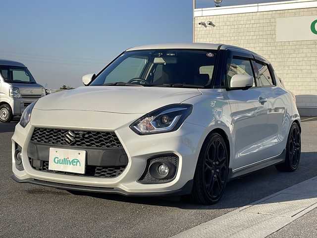 スズキ スイフト スポーツ セーフティPKG 香川県 2018(平30)年 7万km ピュアホワイトP 純正SDナビ（フルセグTV/CD，DVD再生/BT)/アラウンドビューモニター/シートヒーター/ローダウン/HKSマフラー/ビルトインETC/純正フロアマット/オートライト