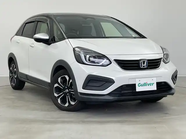 ホンダ フィット e:HEVクロスター 新潟県 2020(令2)年 2.6万km プラチナホワイトパール 純正メモリナビ【VXM-205VFEi】/　フルセグTV/Bluetooth/DVD/USB/ホンダセンシング/・衝突被害軽減ブレーキ/・誤発進抑制機能/・後方誤発進抑制機能/・近距離衝突軽減ブレーキ/・歩行者事故低減ステアリング/・路外逸脱抑制機能/・渋滞追従機能付アダプティブ・クルーズ・コントロール/・車線維持支援システム/・先行車発進お知らせ機能/・標識認識機能/・オートハイビーム/前後コーナーセンサー/前後ドライブレコーダー/バックモニター/ビルトインETC/LEDヘッドライト/横滑り防止装置