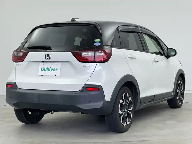 ホンダ フィット e:HEVクロスター 新潟県 2020(令2)年 2.6万km プラチナホワイトパール 純正メモリナビ【VXM-205VFEi】/　フルセグTV/Bluetooth/DVD/USB/ホンダセンシング/・衝突被害軽減ブレーキ/・誤発進抑制機能/・後方誤発進抑制機能/・近距離衝突軽減ブレーキ/・歩行者事故低減ステアリング/・路外逸脱抑制機能/・渋滞追従機能付アダプティブ・クルーズ・コントロール/・車線維持支援システム/・先行車発進お知らせ機能/・標識認識機能/・オートハイビーム/前後コーナーセンサー/前後ドライブレコーダー/バックモニター/ビルトインETC/LEDヘッドライト/横滑り防止装置