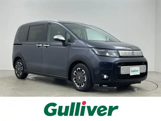ホンダ フリード ハイブリット e:HEV クロスター 埼玉県 2025(令7)年 0.1千km メテオロイドグレーメタリック 登録済未使用車　純正９インチナビ　バックカメラ　ＢＳＭ　ホンダセンシング　アダプティブクルーズコントロール　シートヒーター　ハーフレザー　純正アルミホイール　オートハイビーム　ＬＥＤヘッドライト　ＴＶ