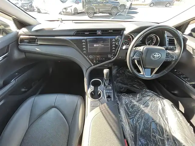 トヨタ カムリ WSレザーパッケージ 愛媛県 2019(令1)年 6.5万km プラチナホワイトパールマイカ 純正ナビ（Bluetooth/SD/フルセグテレビ）/ビルトインETC/バックカメラ/USB入力端子/追従型クルーズコントロール/リアクロストラフィックブレーキ/ブラインドスポットモニター/前後コーナーセンサー/前席パワーシート/前席シートヒーター/レーンキープアシスト/横滑り防止装置/衝突被害軽減システム/カーテンエアバック/純正18インチAW/LEDヘッドライト/フォグランプ/スペアキー