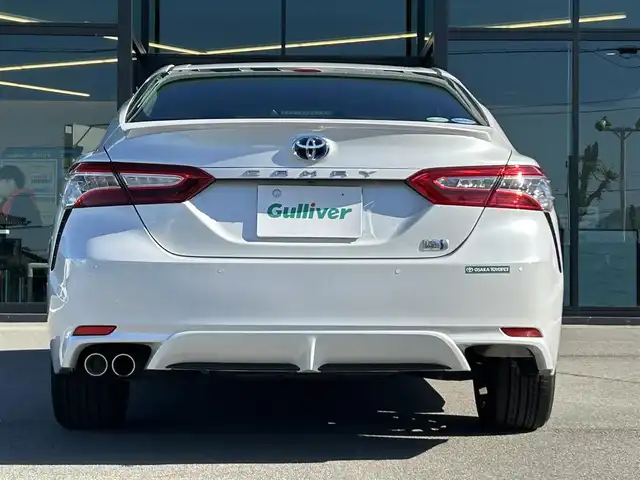 トヨタ カムリ WSレザーパッケージ 愛媛県 2019(令1)年 6.5万km プラチナホワイトパールマイカ 純正ナビ（Bluetooth/SD/フルセグテレビ）/ビルトインETC/バックカメラ/USB入力端子/追従型クルーズコントロール/リアクロストラフィックブレーキ/ブラインドスポットモニター/前後コーナーセンサー/前席パワーシート/前席シートヒーター/レーンキープアシスト/横滑り防止装置/衝突被害軽減システム/カーテンエアバック/純正18インチAW/LEDヘッドライト/フォグランプ/スペアキー