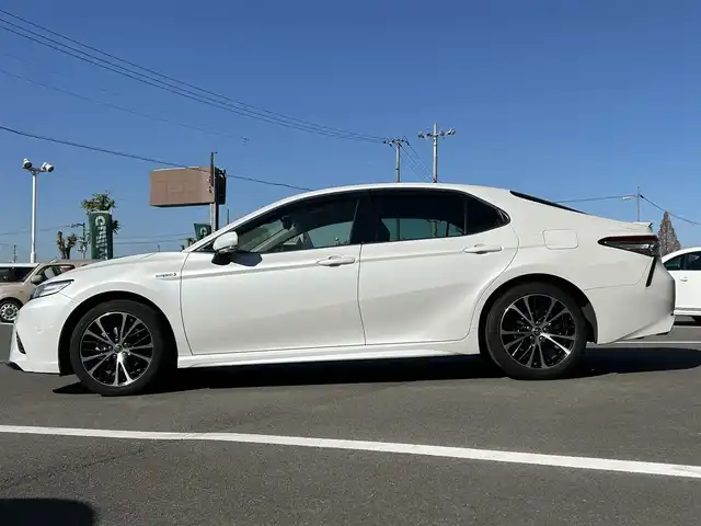トヨタ カムリ WSレザーパッケージ 愛媛県 2019(令1)年 6.5万km プラチナホワイトパールマイカ 純正ナビ（Bluetooth/SD/フルセグテレビ）/ビルトインETC/バックカメラ/USB入力端子/追従型クルーズコントロール/リアクロストラフィックブレーキ/ブラインドスポットモニター/前後コーナーセンサー/前席パワーシート/前席シートヒーター/レーンキープアシスト/横滑り防止装置/衝突被害軽減システム/カーテンエアバック/純正18インチAW/LEDヘッドライト/フォグランプ/スペアキー
