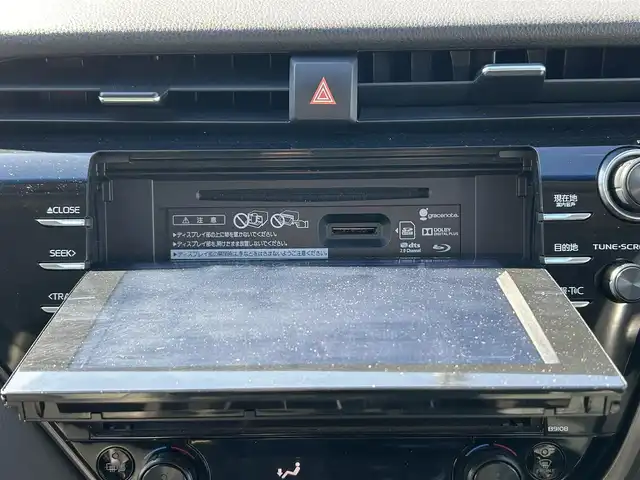 トヨタ カムリ WSレザーパッケージ 愛媛県 2019(令1)年 6.5万km プラチナホワイトパールマイカ 純正ナビ（Bluetooth/SD/フルセグテレビ）/ビルトインETC/バックカメラ/USB入力端子/追従型クルーズコントロール/リアクロストラフィックブレーキ/ブラインドスポットモニター/前後コーナーセンサー/前席パワーシート/前席シートヒーター/レーンキープアシスト/横滑り防止装置/衝突被害軽減システム/カーテンエアバック/純正18インチAW/LEDヘッドライト/フォグランプ/スペアキー