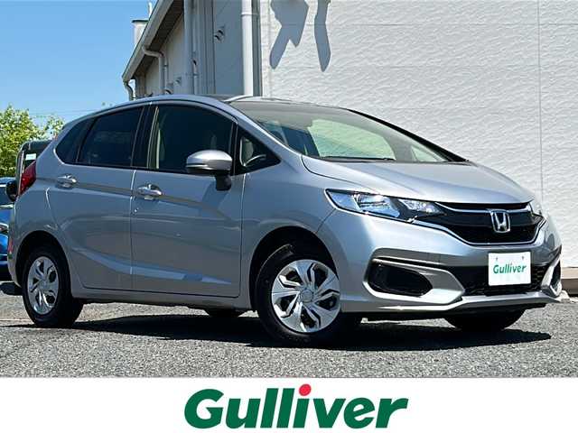 ホンダ フィット 13G F 千葉県 2018(平30)年 0.8万km ルナシルバーM ワンオーナー　保証書　取扱説明書　アイドリングストップ　横滑り防止機能　ＣＤオーディオ　パワーウィンドー　フロアシフト　純正フロアマット　スマートキー　純正１４インチホイール　ハロゲンヘッドライト