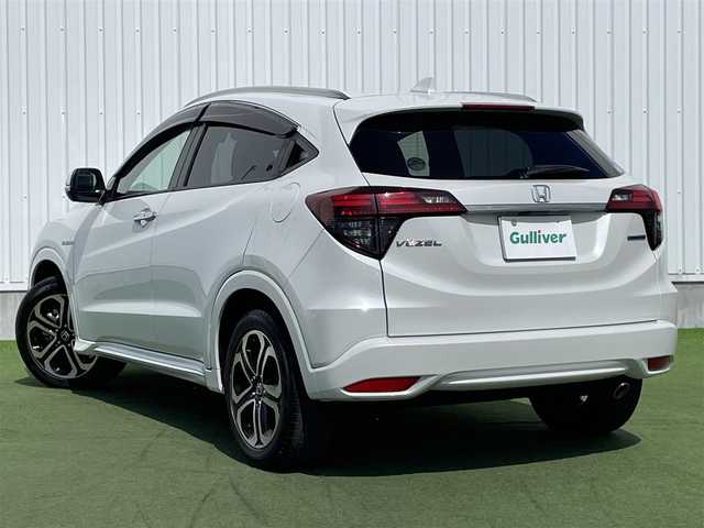 ホンダ ヴェゼル ハイブリッド Z ホンダセンシング 香川県 2019(令1)年 1.9万km プラチナホワイトパール 登録時走行距離：18690km/純正8インチSDナビゲーション/→フルセグTV/→CD/DVD再生/バックカメラ/ビルトインETC/ドライブレコーダー/レーダークルーズコントロール/LEDオートライト/フォグランプ/純正17インチアルミホイール/ステアリングリモコン/パドルシフト/スマートキー/プッシュスタート/純正マット