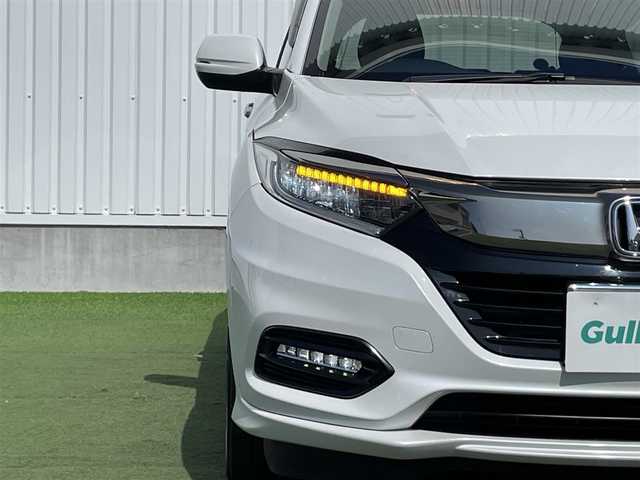 ホンダ ヴェゼル ハイブリッド Z ホンダセンシング 香川県 2019(令1)年 1.9万km プラチナホワイトパール 登録時走行距離：18690km/純正8インチSDナビゲーション/→フルセグTV/→CD/DVD再生/バックカメラ/ビルトインETC/ドライブレコーダー/レーダークルーズコントロール/LEDオートライト/フォグランプ/純正17インチアルミホイール/ステアリングリモコン/パドルシフト/スマートキー/プッシュスタート/純正マット