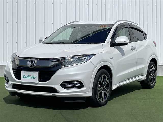 ホンダ ヴェゼル ハイブリッド Z ホンダセンシング 香川県 2019(令1)年 1.9万km プラチナホワイトパール 登録時走行距離：18690km/純正8インチSDナビゲーション/→フルセグTV/→CD/DVD再生/バックカメラ/ビルトインETC/ドライブレコーダー/レーダークルーズコントロール/LEDオートライト/フォグランプ/純正17インチアルミホイール/ステアリングリモコン/パドルシフト/スマートキー/プッシュスタート/純正マット