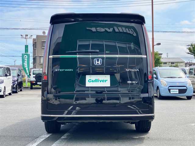 ホンダ ステップワゴン スパーダ eHEV 静岡県 2024(令6)年 0.5万km クリスタルブラックパール エンジンスタートボタン/パワーウィンドウ/パワーステアリング/パドルシフト/アイドリングストップ/スマートキー/スペアキー/Wオートエアコン/クルーズコントロール/ETC2.0/USB入力端子/全方位カメラ/純正11.4インチナビ（CD/DVD/BT/フルセグ）/三列シート/オットマン/電動リアゲート/純正ドライブレコーダー前後/ウォークスルー/純正フロアマット/純正アルミホイール/両側パワースライドドア/ハーフレザー/D席N席シートヒーター/ABS/横滑り防止装置/コーナーセンサー前後/レーンキープアシスト/オートライト/オートマチックハイビーム/LEDヘッドライト/W＋サイドエアバック/衝突軽減システム/カーテンエアバック/BSM/ホンダセンシング