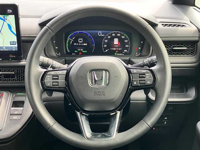 ホンダ ステップワゴン スパーダ eHEV 静岡県 2024(令6)年 0.5万km クリスタルブラックパール エンジンスタートボタン/パワーウィンドウ/パワーステアリング/パドルシフト/アイドリングストップ/スマートキー/スペアキー/Wオートエアコン/クルーズコントロール/ETC2.0/USB入力端子/全方位カメラ/純正11.4インチナビ（CD/DVD/BT/フルセグ）/三列シート/オットマン/電動リアゲート/純正ドライブレコーダー前後/ウォークスルー/純正フロアマット/純正アルミホイール/両側パワースライドドア/ハーフレザー/D席N席シートヒーター/ABS/横滑り防止装置/コーナーセンサー前後/レーンキープアシスト/オートライト/オートマチックハイビーム/LEDヘッドライト/W＋サイドエアバック/衝突軽減システム/カーテンエアバック/BSM/ホンダセンシング