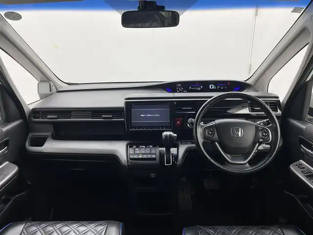 ホンダ ステップワゴン スパーダ ホンダセンシング 茨城県 2016(平28)年 7万km ホワイトオーキッドパール 純正9インチプレミアムインターナビ/ワンセグ/CD/DVD/Bluetooth/AM/FM/ホンダセンシング/・衝突軽減ブレーキ/・アダプティブ・クルーズ・コントロール/・車線維持支援システム/・路外逸脱抑制機能/・誤発進抑制機能/・先行車発進お知らせ機能/・標識認識機能/エアロ(フロント/サイド)/バックカメラ/フリップダウンモニター/LEDヘッドライト/オートライト/Clazziシートカバー