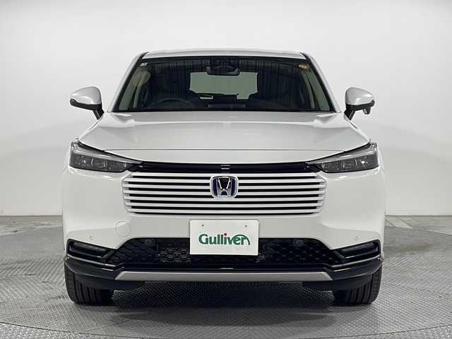 ホンダ ヴェゼル ハイブリッド e:HEV Z 広島県 2025(令7)年 0.1千km プラチナホワイトパール 登録済未使用車（5km）/9型Honda CONNECTディスプレイ/パワーテールゲート/ハーフレザーシート/シートヒーター/ステアリングヒーター/ホンダセンシング/・衝突軽減ブレーキ/・誤発進抑制機能/・レーンキープアシスト/・パーキングセンサー/・アダプティブクルーズコントロール/・アダプティブドライビングビーム/・ブラインドスポットインフォメーション/バックカメラ/減速セレクター/ヒルディセントコントロール/電動パーキングブレーキ/オートブレーキホールド/LEDヘッドランプ/オートライト/ETC2.0/ワイヤレス充電/USB入力端子