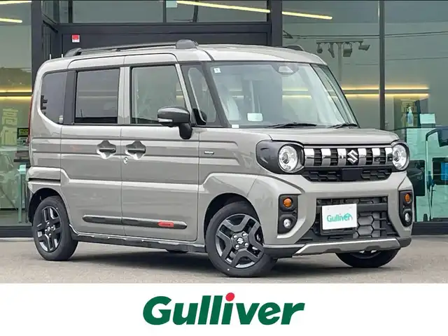 スズキ スペーシア ギア HYBRID XZターボ 東京都 2024(令6)年 0.1千km モスグレーメタリック 届出済未使用車/純正9インチナビ/フルセグ/全方位モニター/両側パワースライドドア/シートヒーター/ステアリングヒーター/アイドリングストップ/パドルシフト/コーナーセンサー/ヘッドアップディスプレイ/アダプティブクルーズコントロール/デュアルセンサーブレーキサポート/レーンキープアシスト/LEDヘッドライト/スマートキー
