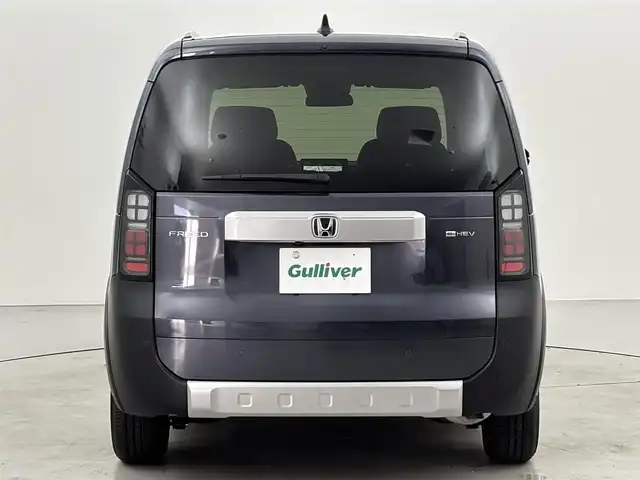 ホンダ フリード ハイブリット e:HEV クロスター 福岡県 2025(令7)年 0.1千km メテオロイドグレーメタリック 登録済未使用車　/純正ナビ／フルセグＴＶ　/バックカメラ　/レーダークルコン　/コーナーセンサー　/衝突軽減ブレーキ　/レーンキープ　/アクセル踏み間違い防止　/ＢＳＭ　/両側電動スライドドア　/シートヒーター　/ＬＥＤ